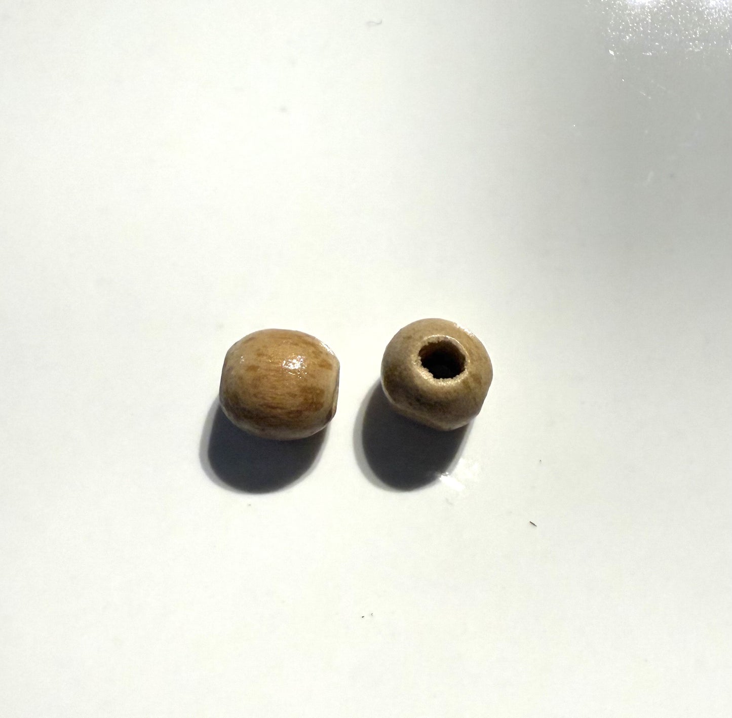 Beige houten kraal 7mm